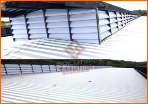O Poder do Lanternim: Mostra um lanternim instalado no teto, através do qual a luz do sol penetra, iluminando o ambiente de maneira difusa e agradável. Abaixo, pessoas trabalham confortavelmente, beneficiando-se do ar fresco e da temperatura agradável proporcionada pela circulação de ar eficiente do lanternim, que elimina o ar quente e permite a entrada de ar fresco. A imagem transmite a ideia de um ambiente de trabalho saudável, sustentável e produtivo, evidenciando os benefícios econômicos e ambientais dos lanternins.
